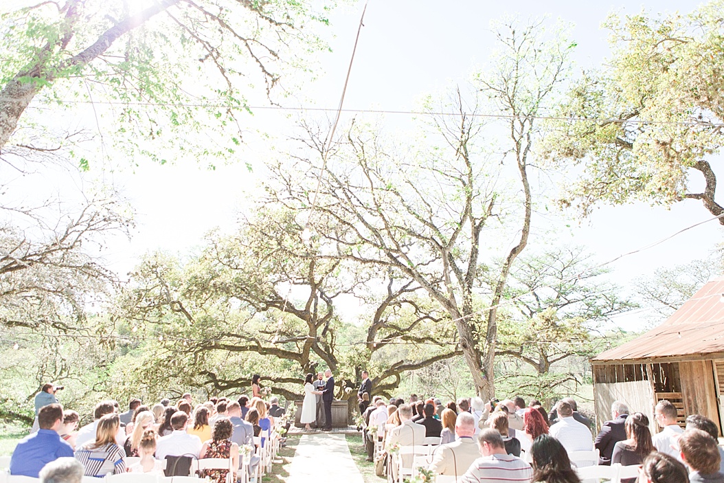 A Modern Sisterdale Dancehall Wedding in Boerne Texas by Allison Jeffers Wedding Photography featuring a sage, burgundy, and pale pink color palette 0030